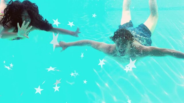 Vertical video: Two swimmers gliding in pool, approach causing stars and light rippling for health