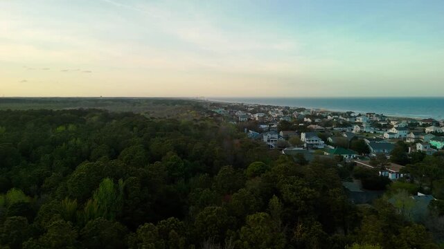 Aerial view of water tower and coastal resort at sunset in Sandbridge Virginia Beach