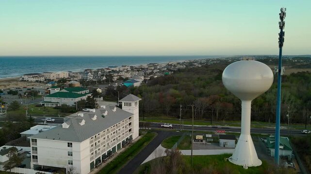Aerial view of water tower and coastal resort at sunset in Sandbridge Virginia Beach