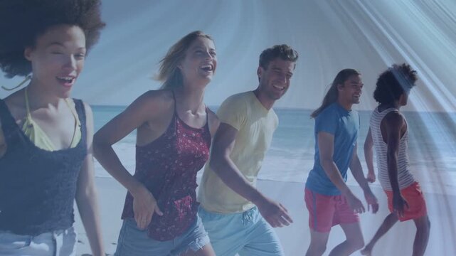 Six adults walking shoreline while camera panning right, light flare crossing, selling beach travel