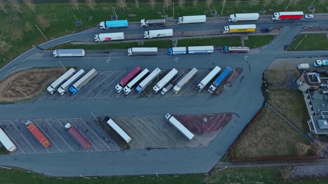 Industrial Vehicle Storage Area Featuring Fleet And Organized Parking Spaces. An Expansive Transportation Facility Showcasing Rows Of Parked Trailers And Designated Loading Zones