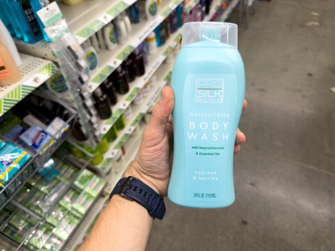 Silk Elements Body Wash Coconut and Bamboo Oil Bottle Held in Dollar Tree Store Aisle