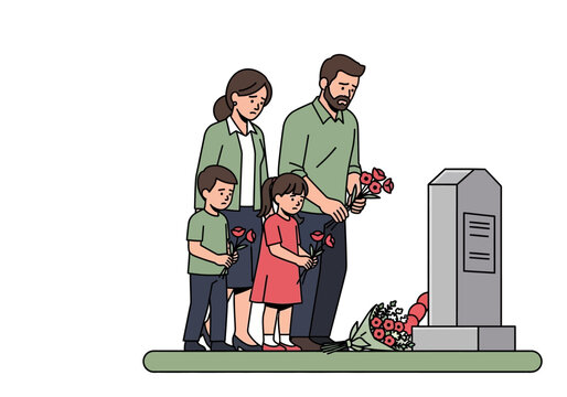 Family paying respects at grave site.