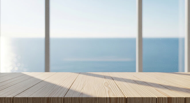 Sunny wooden table top with a view of the sea through a large window creating a serene coastal atmosphere and bright ambiance