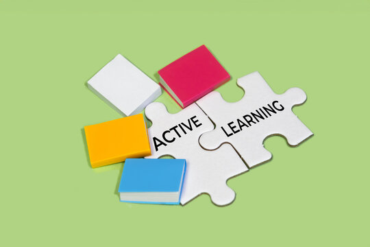 Active learning puzzle pieces and colorful books concept