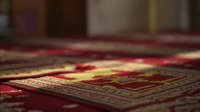 Close-up of a prayer rug with intricate patterns, illuminated by soft light, suggesting a place of worship and reflection