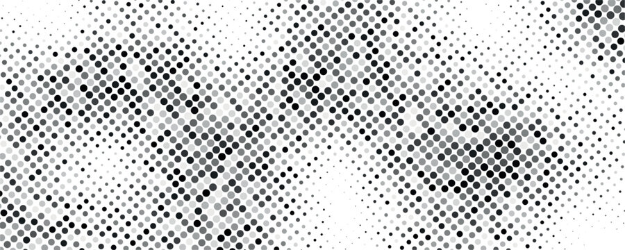 This abstract image displays a dense grainy pattern of black and white dots resembling static or noise