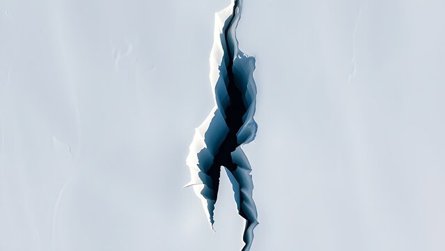 uriel. Aerial view of a deep lightning-shaped crack splitting a smooth glacier surface. travel magazines, destination branding, designed for travel destination branding, used by lab technicians.