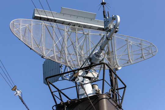 Radar transmit and beam from the mast of a warship during a mission to detect enemy ships.
