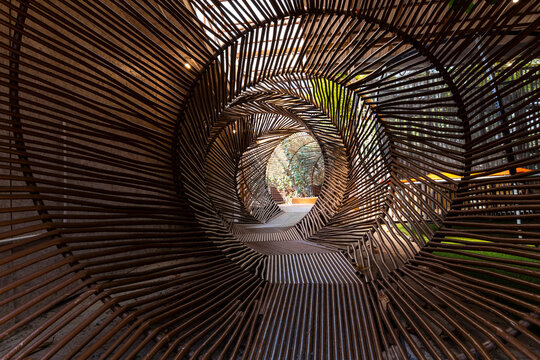 Abstract circular metal pipe tunnel corridor with optical illusion effect.