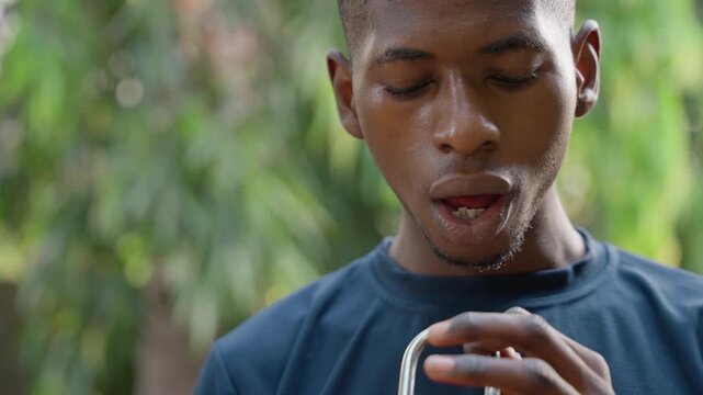 Carpenter inspecting chisel with sawdust, face speckled with wood particles, outdoor workshop background, focused expression, slowmotion closeup, hands holding metal tool, natural sunlight