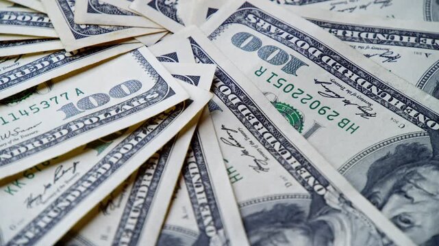 Crisp, new hundred-dollar bills are beautifully arranged, creating an inviting spread. Each bill shines, symbolizing opportunities that lie ahead in a vibrant world of finance