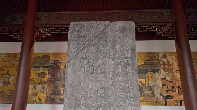 Ancient stone tablets and inscriptions displayed at the Qianwang Temple in Hangzhou