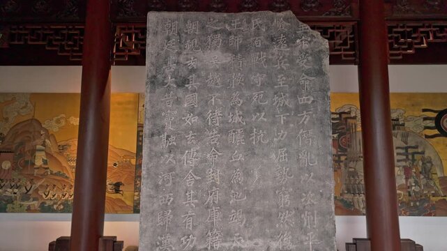 Ancient stone tablets and inscriptions displayed at the Qianwang Temple in Hangzhou