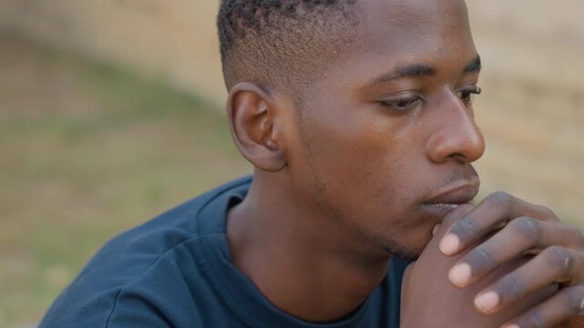 Thoughtful Black carpenter closeup hands planning next cut, gritty palms and calluses visible, intense gaze, mental measuring and sketching, intimate portrait of craft and concentration in carpentry.