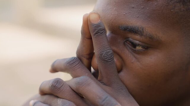 Black joiner closeup with dusty hands, carpentry detail shot with fingertip on grain, sawdust speckling skin, intense gaze, meticulous concentration, shallow depth, intimate portrait of craft