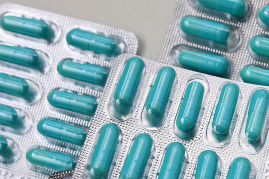 Blue capsules of Doxycycline in blister packs.