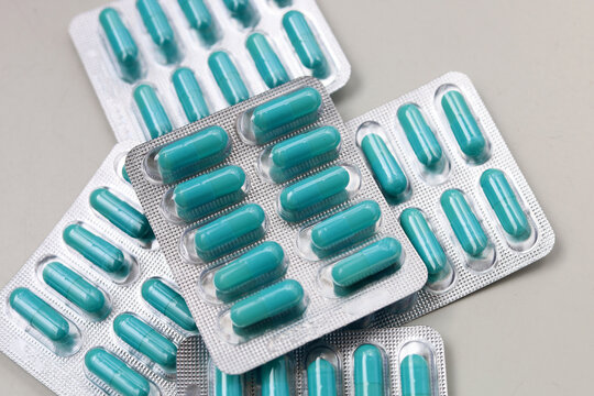 Blue capsules of Doxycycline in blister packs.