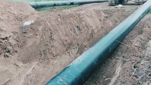 Large 18 Inch Industrial Gas Pipeline Being Lowered Into Trench