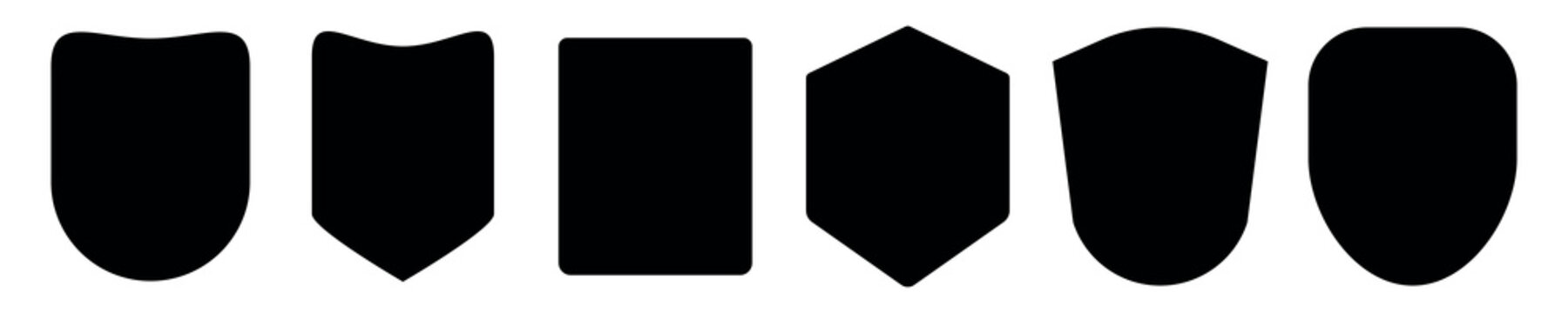 Set of five black shield silhouettes, each with a unique shape. Shield shapes include rounded, square, and pointed. Ideal for design and emblem projects. Element vector set.
