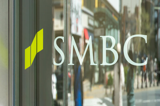 TOSHIMA, TOKYO, JAPAN - APRIL 3, 2026: The corporate branding logo of Sumitomo Mitsui Banking Corporation (SMBC) on a glass wall of a branch office in Toshima, Tokyo.