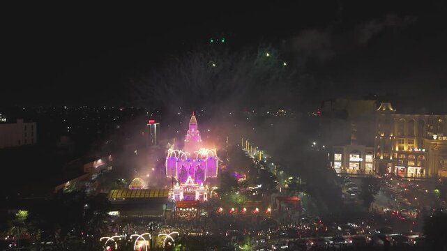 Raipur temple fireworks night view, Night celebration at temple with fireworks, City temple illuminated with fireworks, Festive night skyline Ram Mandir temple raipur stock video.