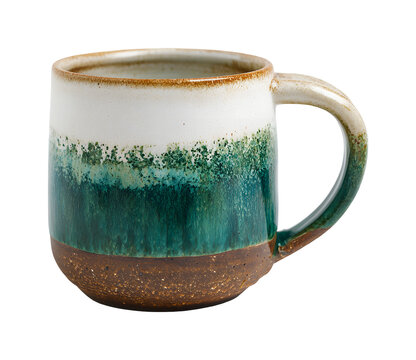 Rustic handmade ceramic mug with ombre green and brown reactive glaze isolated on transparent background