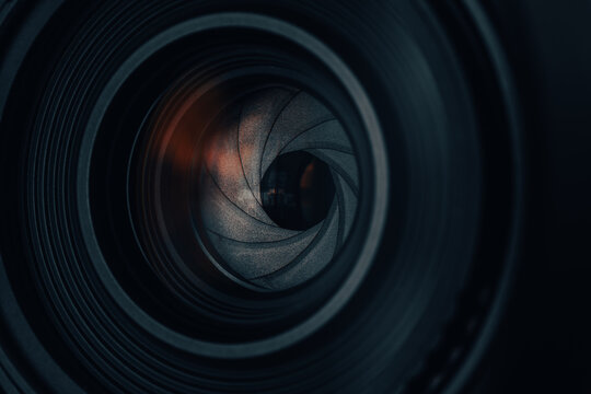 Close-up of a Camera Lens Aperture Blades with Mechanical Detail,Macro,A detailed, high-angle macro shot focusing on the iris diaphragm of a professional camera lens. The image showcases.
