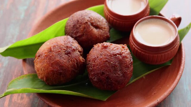 Indian snack Kerala food bonda made from wheat flour and milk tea undampori	
