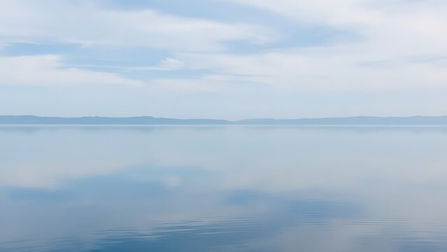 mistreat. A perfectly flat lake mirroring the sky with a seamless horizon. travel magazines, destination branding, designed for outdoor magazines and nature guides and travel destination branding.