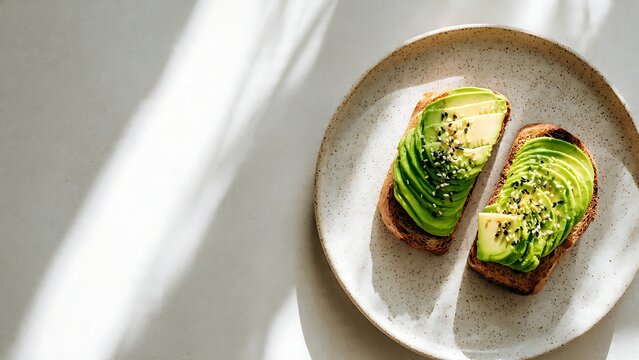 Fresh avocado toast with seeds in beautiful morning sunlight