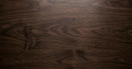 Fotobehang Scandinavisch Close-up of dark walnut wood surface showcasing natural grain patterns and textures, ideal for backgrounds and design projects highlighting natural materials.  © Vhagar