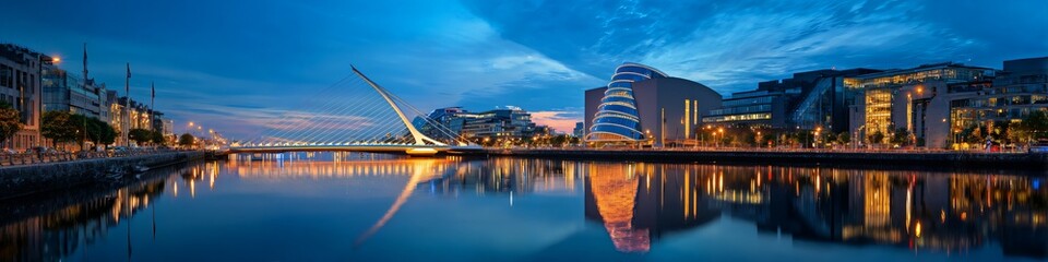 Obraz premium City skyline reflects in calm river at twilight