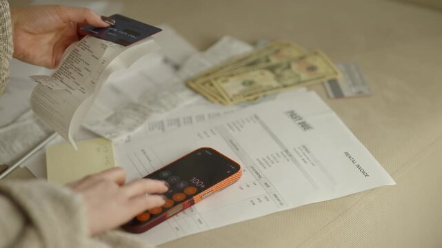 Using Smartphone Calculator To Sum Up Bills And Expenses. Finance Planning And Debt Calculation