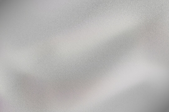 Brushed metal texture background with gray shiny steel surface and subtle striped pattern design