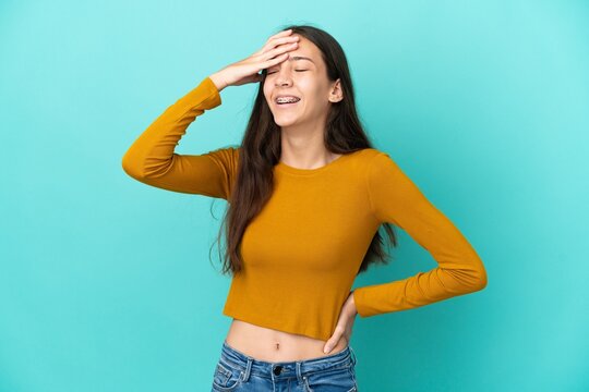Young French woman isolated on blue background smiling a lot