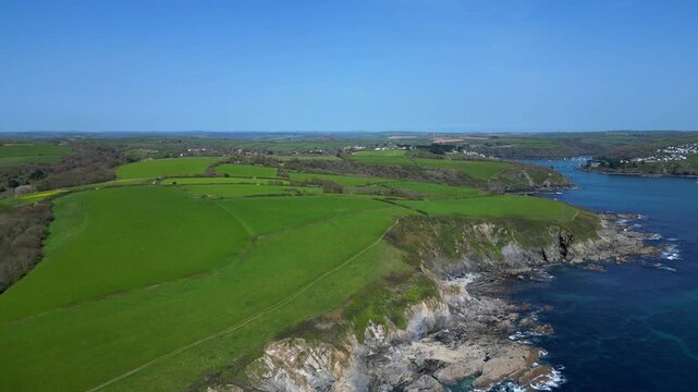 River Fowey, Cornwall, England: DRONE VIEWS: The drone flies over the mouth of the Fowey River; Polruan is to the right of picture. Cornwall is a popular UK holiday destination.