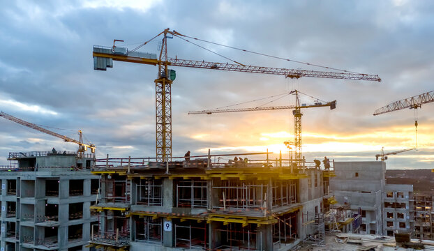 Sunset casts warm glow over construction site
