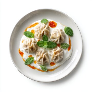 Mant plate with Turkish dumplings yogurt sauce tomato butter isolated on a white background