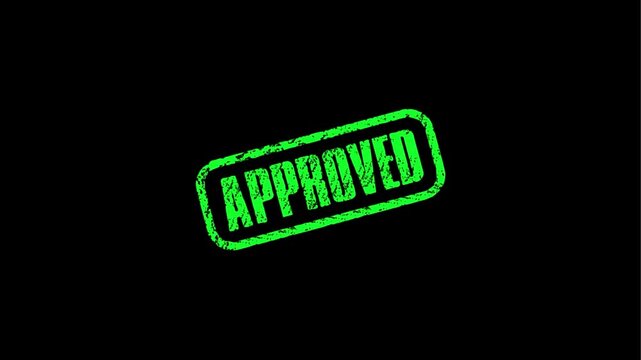A black approved stamp on a bright green background