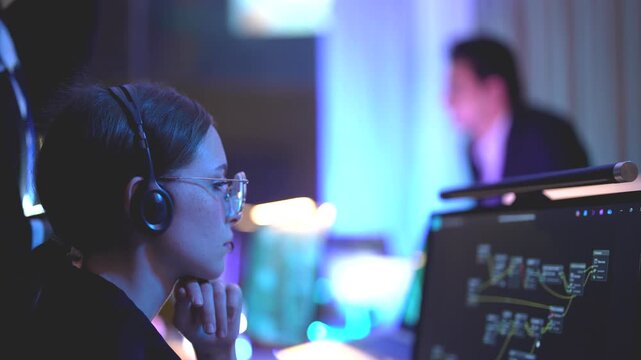 Cyber security expert managing digital safeguard protocols inside a sophisticated dark workspace hub with immersive neon blue monitor glow and professional cinematic lighting effects during ni...