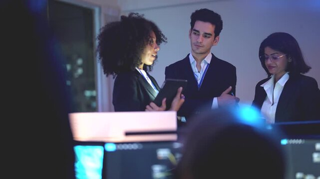 Systems architect reviewing analytical dashboards inside a sophisticated dark workspace hub with immersive neon blue monitor glow and professional cinematic lighting effects during night shift.