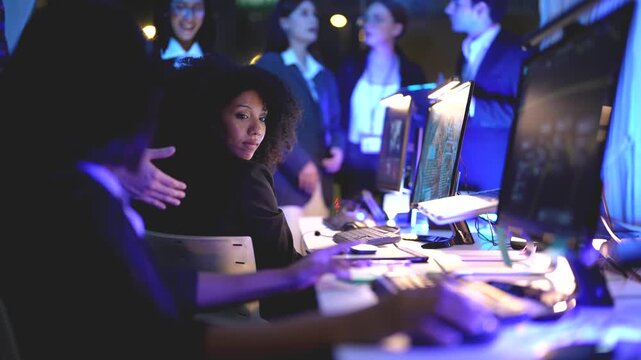 Systems architect reviewing analytical dashboards inside a sophisticated dark workspace hub with immersive neon blue monitor glow and professional cinematic lighting effects during night shift.