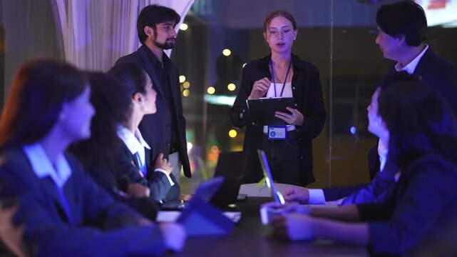 IT consultant facilitating global data transition inside a sophisticated dark workspace hub with immersive neon blue monitor glow and professional cinematic lighting effects during night shift.