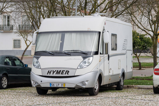 Hymer recreational vehicle parking in a Portuguese town square
