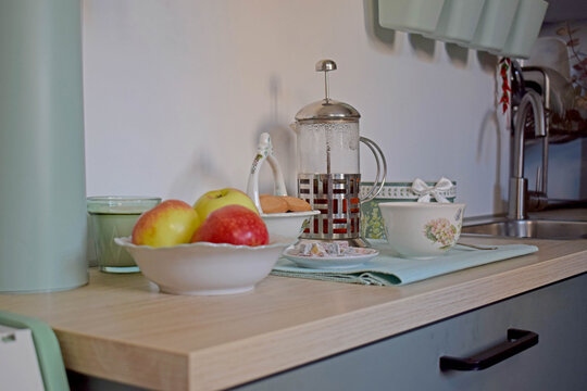 Kitchen countertop with apples and tea