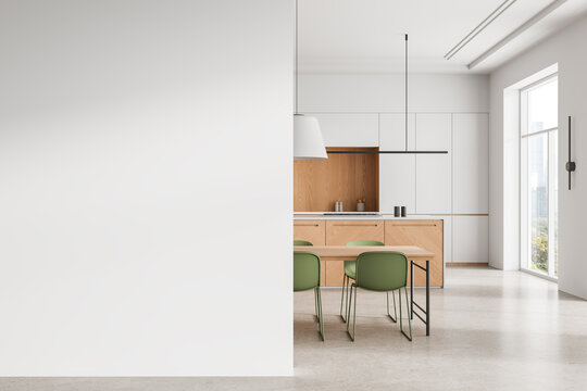 Minimal interior kitchen mockup with blank white wall beside modern wooden cabinetry, green chairs and bright architectural space design template illustration.. 3D Rendering