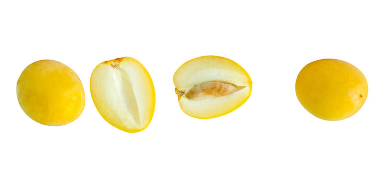 Top view set of fresh ripe yellow Barhi date palm fruits witth halves isolated with clipping path Concept of iftar food in Ramadan for Muslims