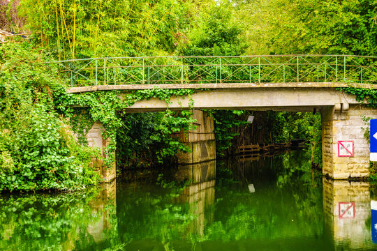River with bridge. Coulon town in France