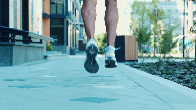 Young man exercising outside. Slow motion video of guy start running steps and falling down. Pain hurt and ache in knea area. Suffer and scream out loud. Sportsman need help.